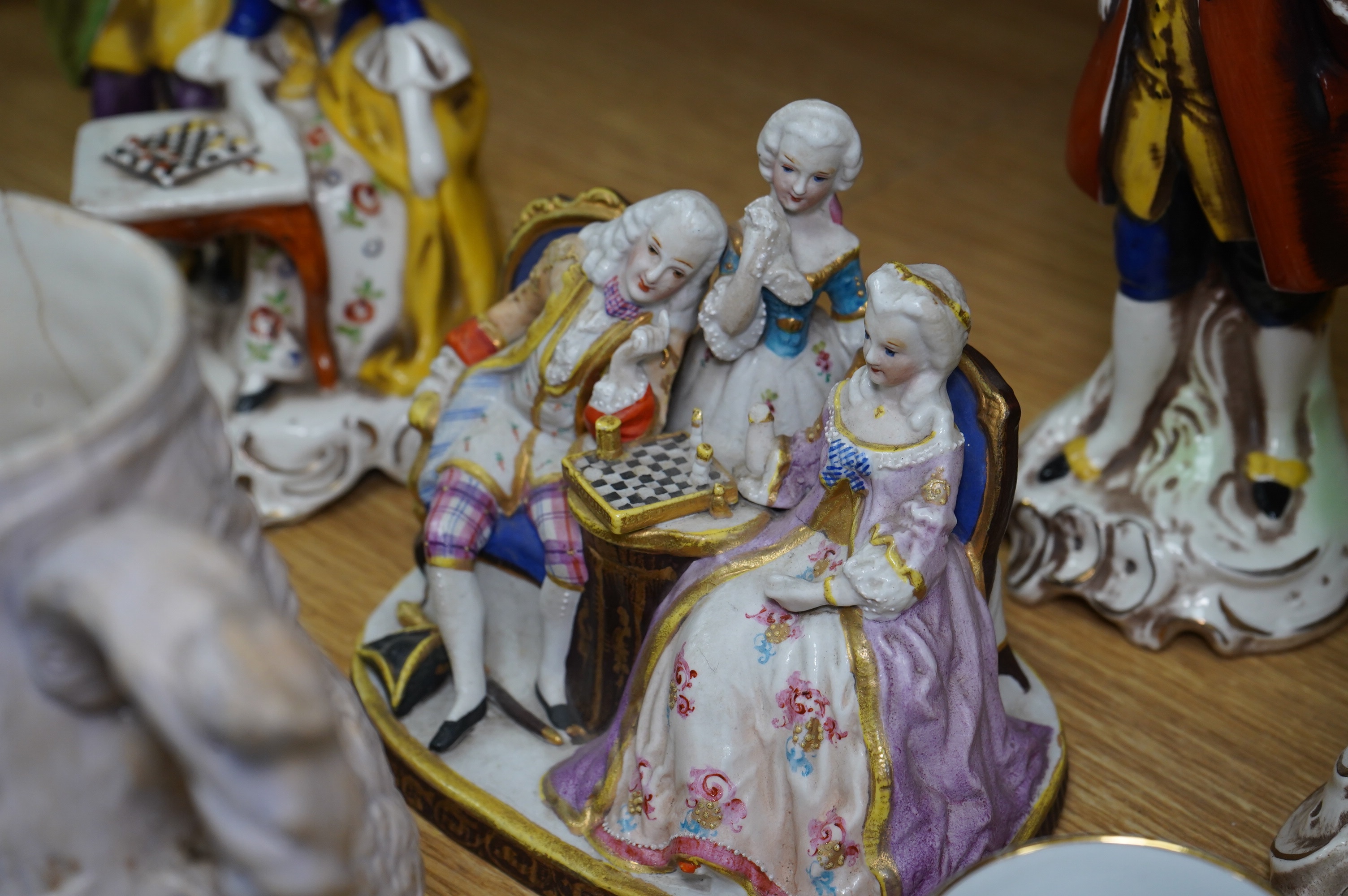 A quantity of 19th and early 20th century ceramics including two chess playing groups, four further Continental figures, a copy of a Meigh teapot, three cups and saucers, two Meissen pots and covers, etc. Condition - var